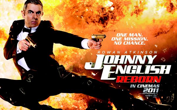 click to free download the wallpaper--2011 Johnny English Reborn Post in 2560x1600 Pixel, Handsome Man Breaking Through, What is He Up to - TV & Movies Wallpaper