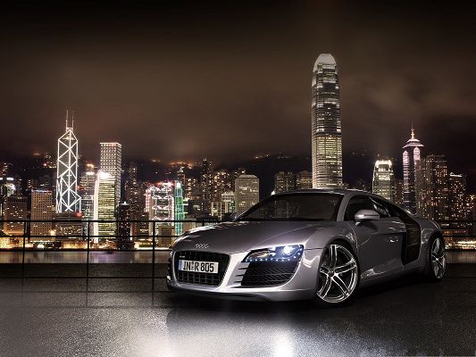 click to free download the wallpaper--Audi R8 Car Wallpaper, Silver and Decent Car, Lighted Up Buildings