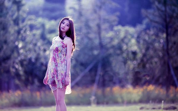 click to free download the wallpaper--Beauty in Flowery Short Dress, Gentle Wind is Blowing by, She is a Little Down, Is There Someone to Please Her? - HD Attractive Girls Wallpaper