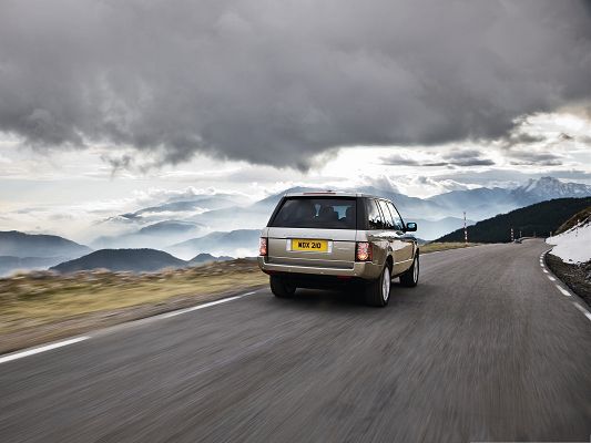 click to free download the wallpaper--Best Cars Picture, Range Rover Car on Flat Straight Road, Under the Cloudy Sky