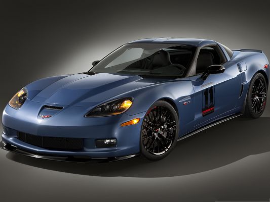 click to free download the wallpaper--Chevrolet Corvette Wallpaper, Blue Glowing Car in the Stop, Nice and Great in Look
