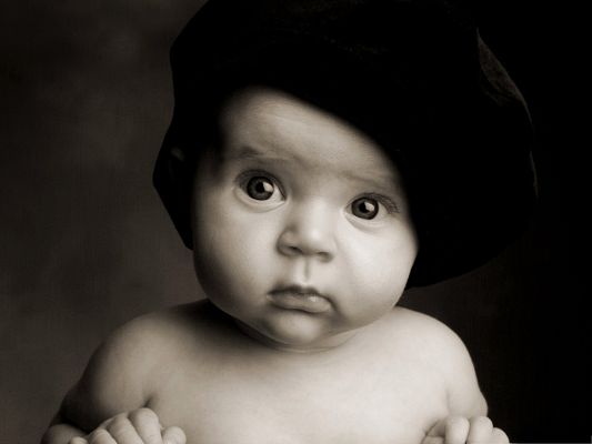 click to free download the wallpaper--Cute Baby Images, Innocent Baby in Black Hat, Wide Open Eyes