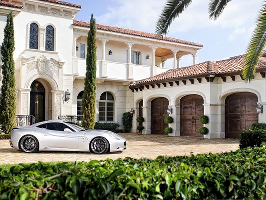 click to free download the wallpaper--Ferrari Car Wallpaper, Silver Supercar in Front of a Villa, Clean and Impressive Scene