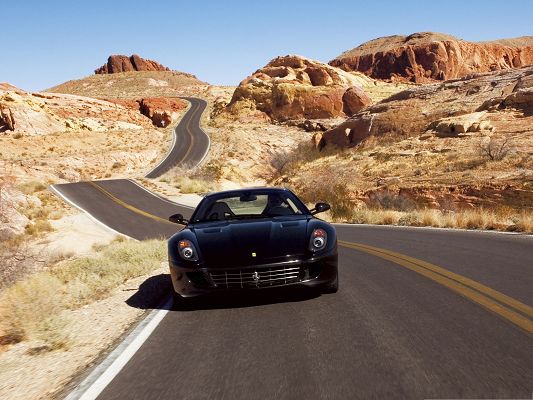 click to free download the wallpaper--Ferrari Sport Car as Wallpaper, Black Super Car Running on a Slope, Great Hills Alongside