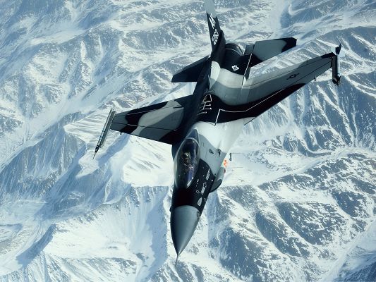 click to free download the wallpaper--Free Aircrafts Wallpaper, Military Plane Flying Over Snow-Capped Mountains