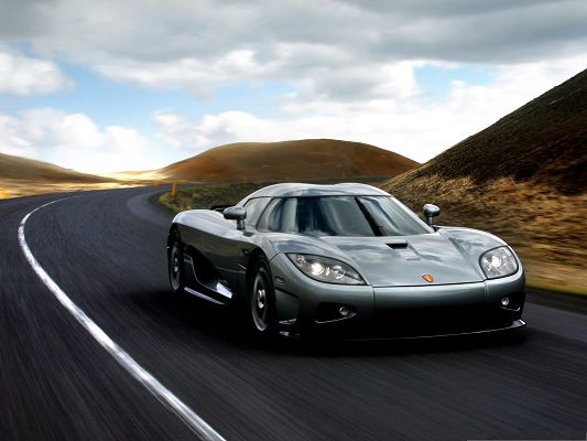 click to free download the wallpaper--Free Cars Wallpaper, Koenigsegg CCX Turning a Corner