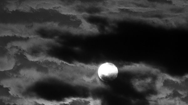 click to free download the wallpaper--Free Download Natural Scenery Picture - The Round Moon in the Middle of the Sky, Surrounded by Dark Clouds, What Happened?