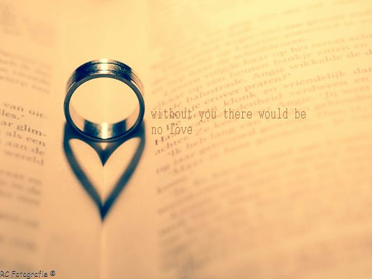click to free download the wallpaper--Free Romantic Wallpaper, a Ring in Heart-Shaped Reflection