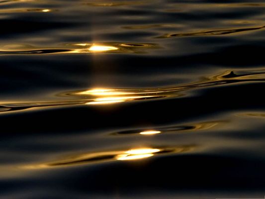 click to free download the wallpaper--Free Sea Wallpaper, Waving Water Surface, Golden and Shinning Look