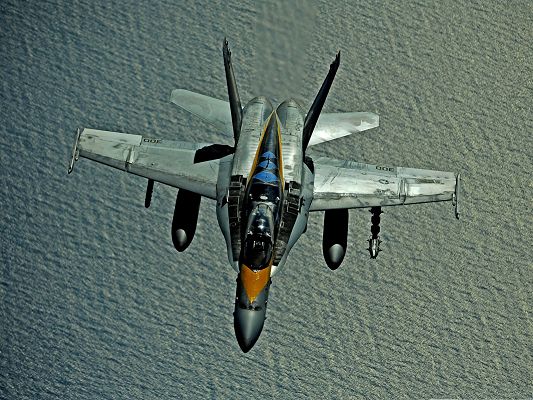 click to free download the wallpaper--Free Wallpaper for Computer Desktop, Hornet F182 Flying Over the Ocean