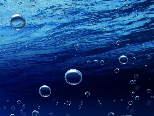 click to free download the wallpaper--Free Water Bubbles Wallpaper, Underwater Bubbles in the Blue Sea