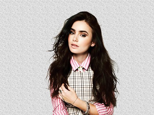 click to free download the wallpaper--Incredible TV Show Images, Beautiful Lily Collins in School Suit, Long Black Hair