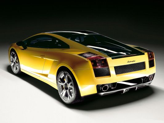 click to free download the wallpaper--Lamborghini Sport Cars Wallpaper, Yellow Super Car in Stop, Glowing Body