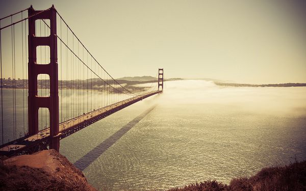 click to free download the wallpaper---Long and Wide Bridge, Cars are Still in the Run, Safety and Comfort Can be Gained - HD Golden Gate Bridge Wallpaper
