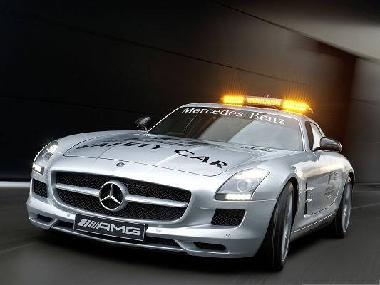click to free download the wallpaper--Mercedes Benz SLS Wallpaper, Silver Safety Car, Golden Lights Above