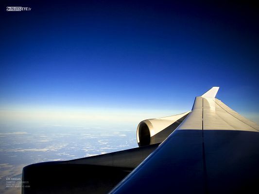 click to free download the wallpaper--Natural Scenery Pics, an Aeroplane Flying in the Blue Sky, Feeling Safe and Secured