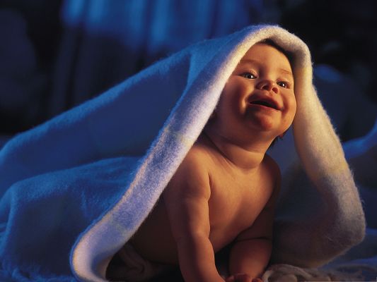 click to free download the wallpaper--Smiling Baby Picture, Cute Baby Just Done Bathing, Covered with White Blanket