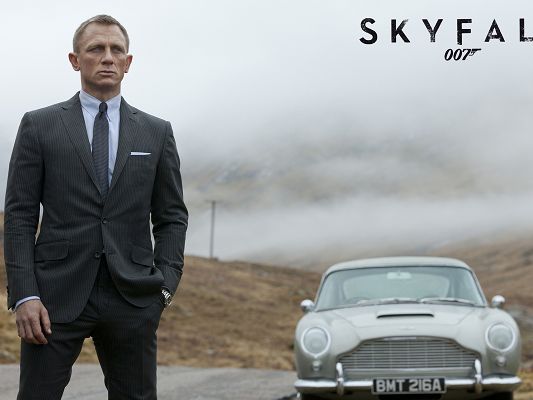 click to free download the wallpaper--TV & Movies Desktop Wallpaper, James Bond Skyfall, Standing by Aston Martin, the Guy is Unbelieveable