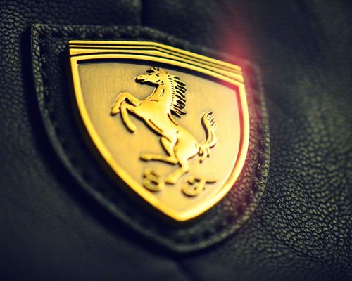 click to free download the wallpaper--Top Brand Images, Golden Ferrari Logo, is Decent and Impressive