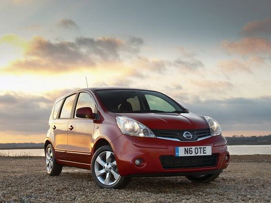 Top Cars Image, Red Nissan Car Under the Blue Sky, Facing the Sea