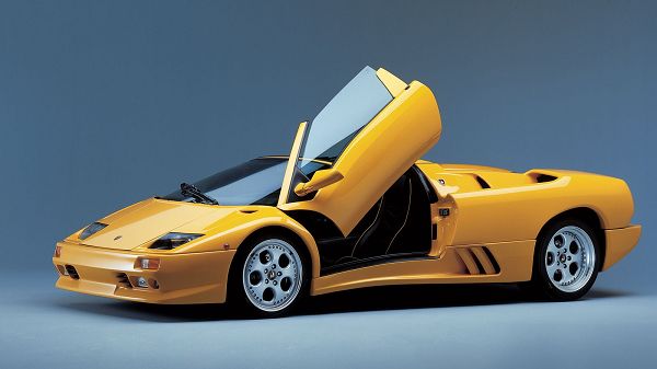 click to free download the wallpaper--Yellow Lamborghini Car with Doors Open, They Are Like Stretched out Wings, Driving is Like Flying, a Super Car - HD Cars Wallpaper
