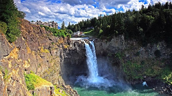 click to free download the wallpaper--images of nature - A Large Waterfall Running Straight Down, Green Plants Surrounding, What a Scene!