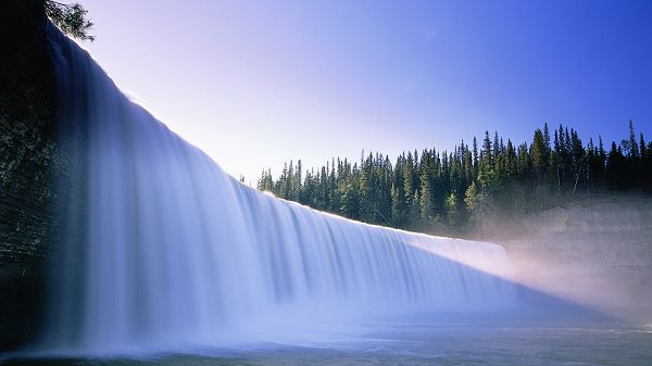click to free download the wallpaper--natural scene photo - A White and Pure Waterfall, Green Plants Making the Surround
