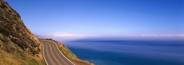 click to free download the wallpaper--nature scenes - The Incredibly Blue Sea and Sky, a Narrow and Straight Road