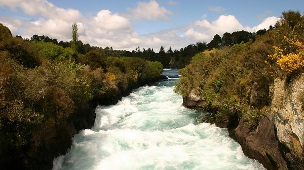 click to free download the wallpaper--sceneries pictures - A Twisting River, Rushing by the Natural Plants, the Blue Sky, Fitting Each Other